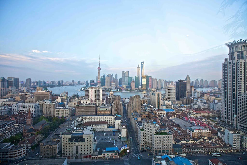 A breathtaking view of Shanghai's skyline featuring iconic skyscrapers and the Huangpu River.